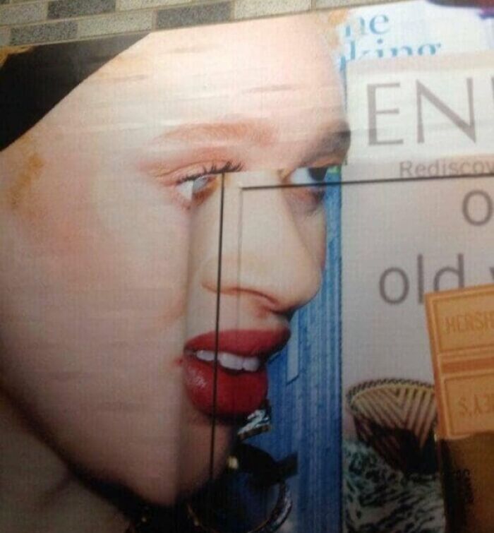 Close-up of a distorted face on a billboard showing an unattainable body in funny advertising fails.