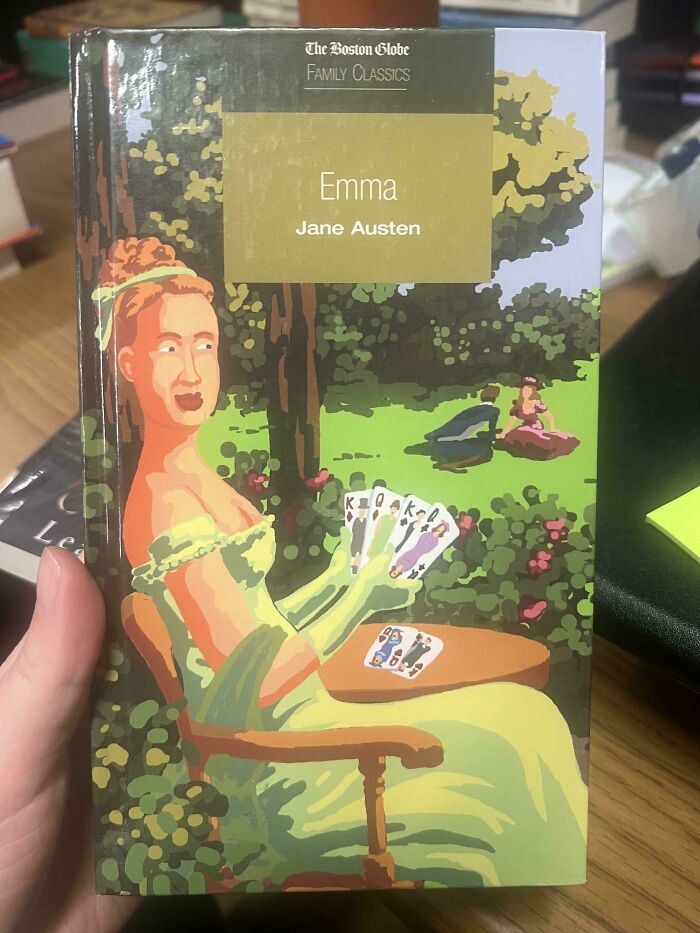 Book cover of Emma by Jane Austen with a poorly drawn woman holding playing cards in a garden scene, a funny book cover example.