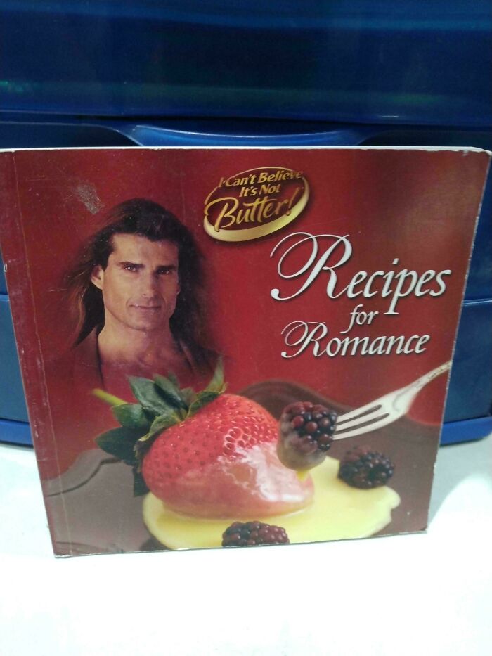 Book cover showing a man with long hair, a strawberry, and blackberries in butter for funny awful book covers.