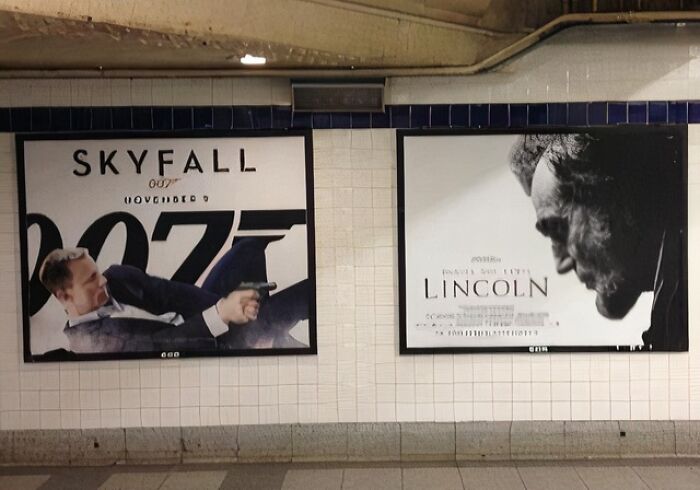 Two advertising posters on a tiled wall showing distorted movie ads, illustrating funny advertising fails.