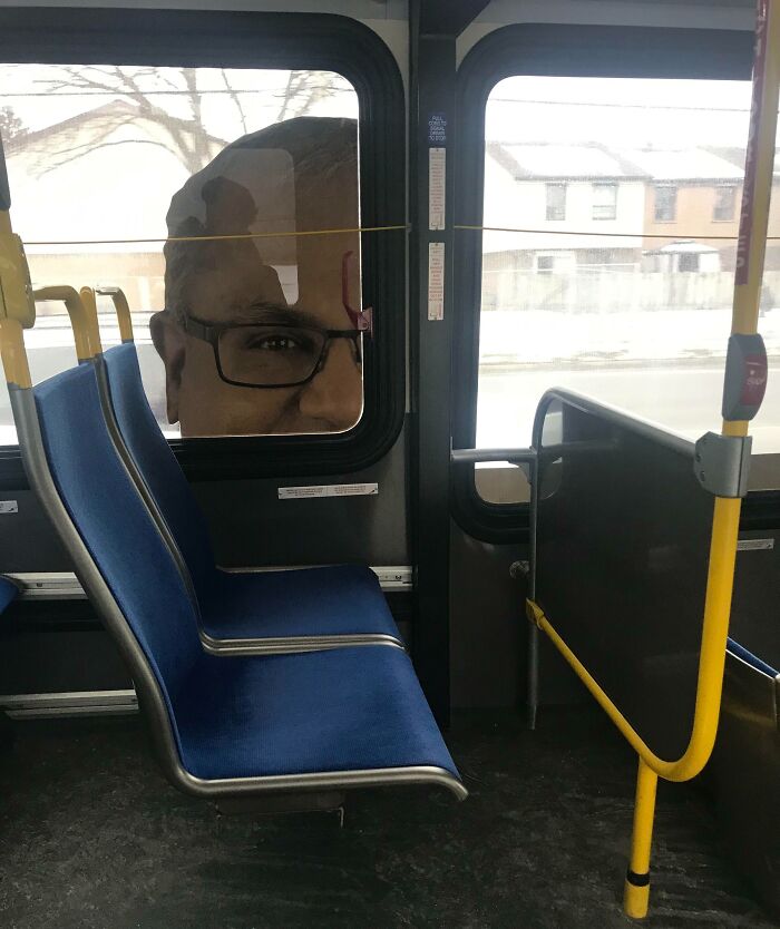 Bus window advertisement showing a face placed to create an unattainable body illusion, highlighting funny advertising fails.