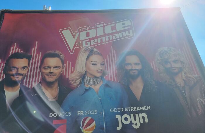 Billboard with distorted faces showing another unattainable body portrayed in advertising as a funny advertising fail.