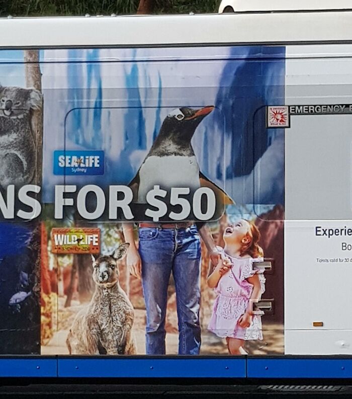 Bus advertisement showing a person with a penguin head and a kid, illustrating funny advertising fails with unattainable body portrayal.