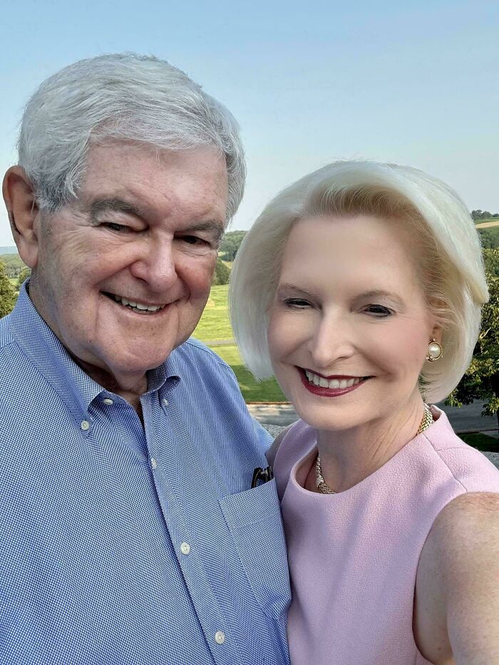 Older couple smiling outdoors in a bright setting, illustrating Instagram vs reality pics and how out of touch some people really are.