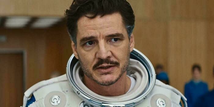 Actor in a space suit scene from a bad movie, highlighting confusing details discussed in an online group about bad movie details.