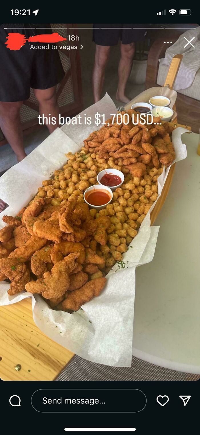 Large serving of fried dishes arranged in a boat with dipping sauces, showing one of the 102 dishes that are just stupid.