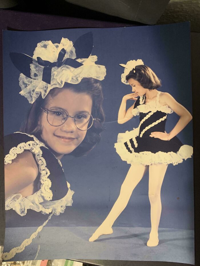 Vintage photo of a young girl in a frilly costume and glasses, a classic example of regrettable past cringe moments.