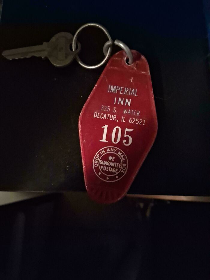 Vintage red motel key tag from Imperial Inn with room number 105, a nostalgic item that makes people who recognize it feel very old.
