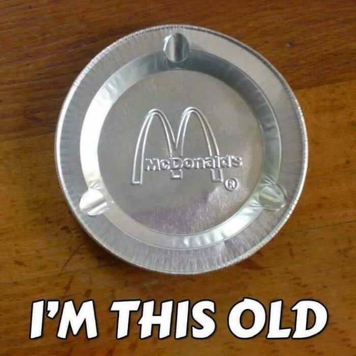 Vintage McDonald's metal ashtray on wooden table, a nostalgic item that makes people who recognize it feel very old.