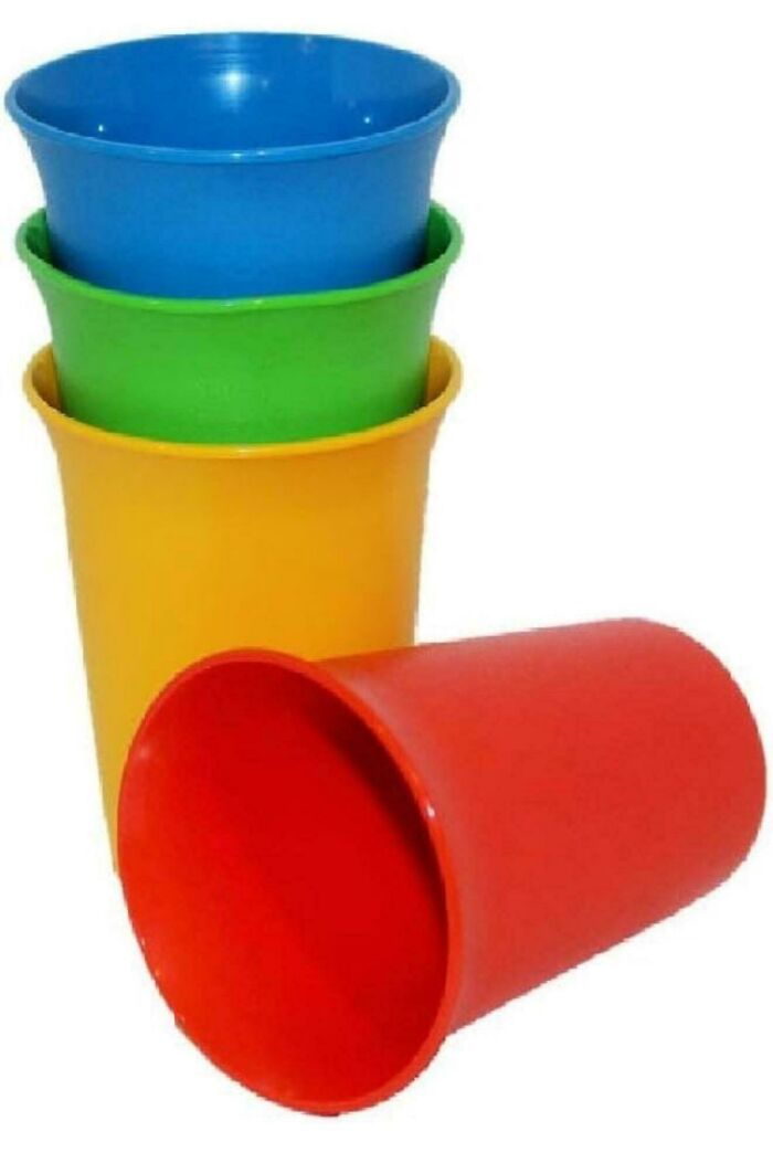 Stacked colorful plastic cups in red, yellow, green, and blue, nostalgic item that makes people feel very old.