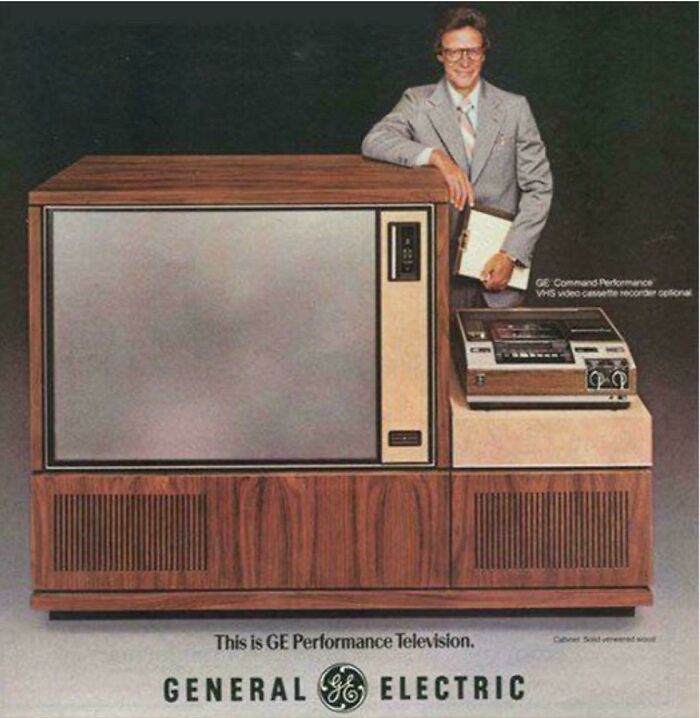 Vintage General Electric Performance television with wood paneling and VHS video cassette recorder, evoking nostalgia for things that feel very old.