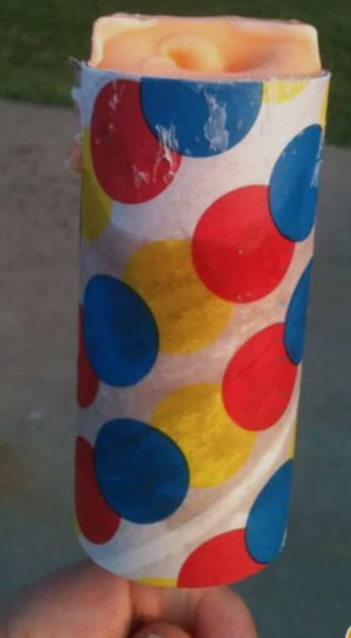 Colorful retro popsicle wrapper with large red, blue, and yellow dots, evoking nostalgia for people who recognize them.