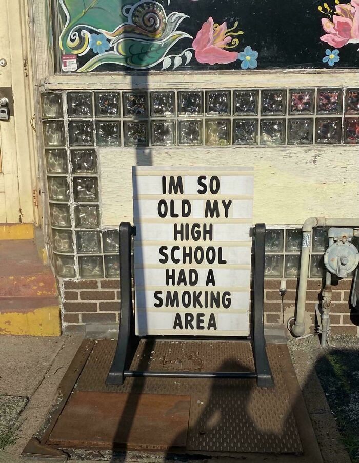 Signboard outside a building humorously referencing things that make people who recognize them feel very old.