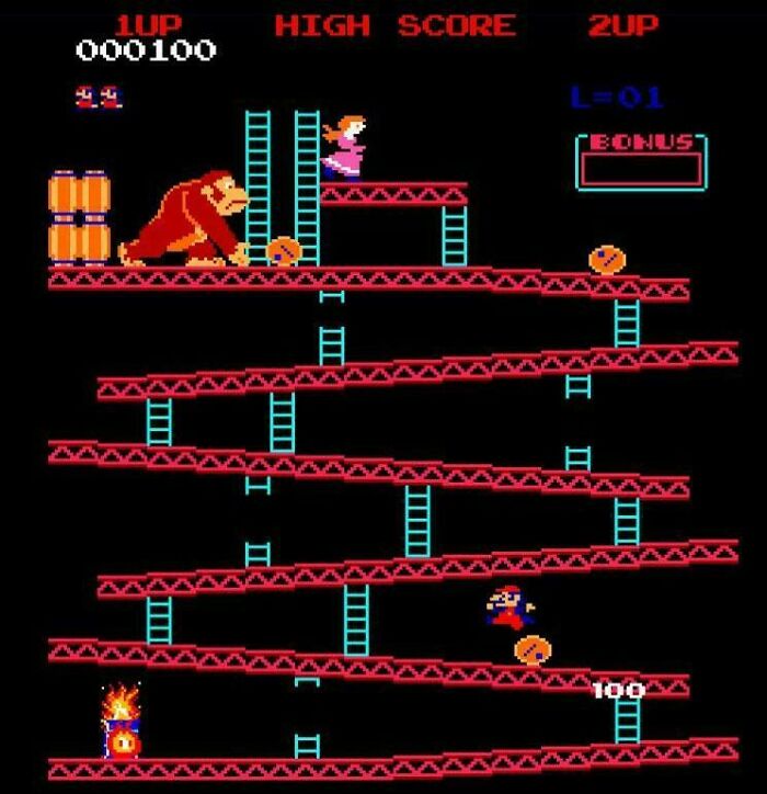 Classic arcade game Donkey Kong screen showing pixelated characters climbing ladders and avoiding barrels, nostalgic retro gaming.
