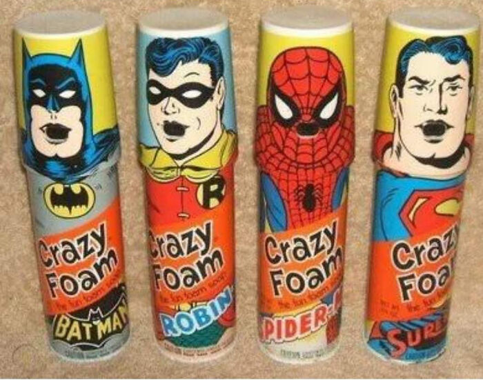 Vintage superhero-themed Crazy Foam cans featuring Batman, Robin, Spider-Man, and Superman from old toy collections.