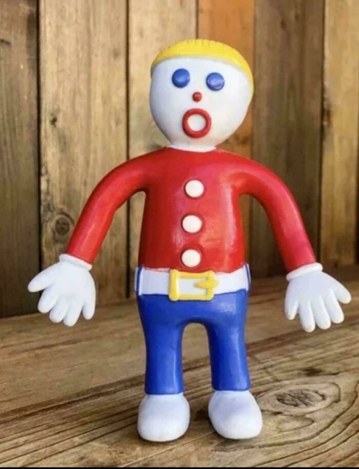 Vintage plastic toy figure with red shirt and blue pants, one of the things that make people who recognize them feel very old.