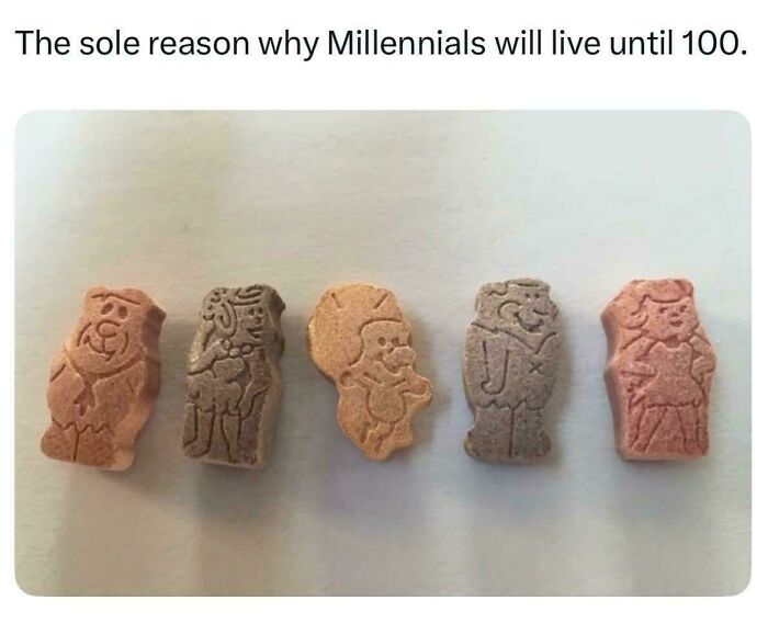 Multicolored Flintstones vitamin gummies shaped like cartoon characters, nostalgic item for people who recognize them.