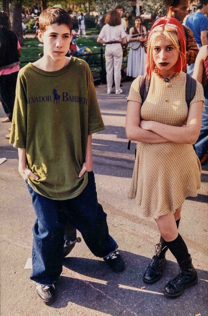 Teenagers dressed in 90s fashion with oversized clothes and edgy style in outdoor 90s nostalgic memes scene