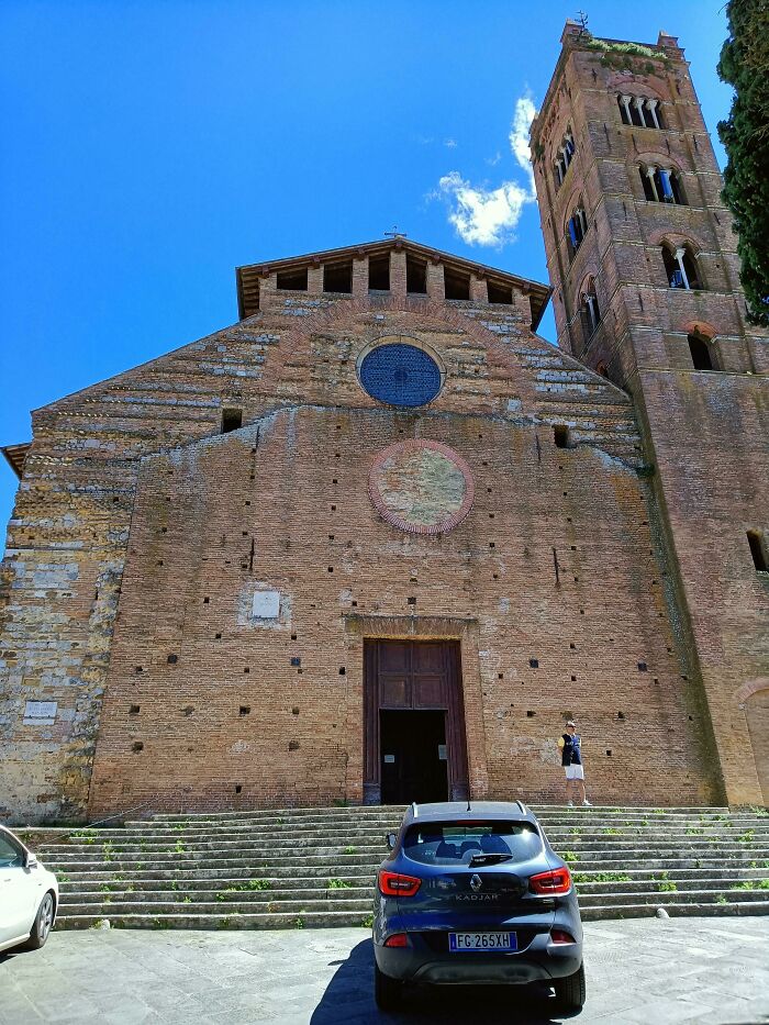 Old brick building with uneven holes and mismatched features, illustrating imperfect things that annoy people with OCD.