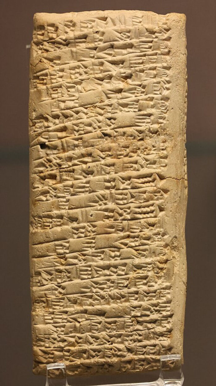 Ancient clay tablet with cuneiform script, featured in online group sharing interesting facts and pics.