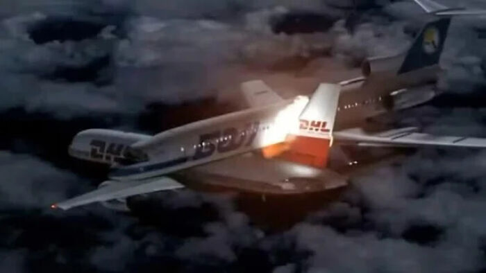 Two DHL planes flying closely at night over clouds, illustrating a fascinating moment from an online group sharing interesting facts.