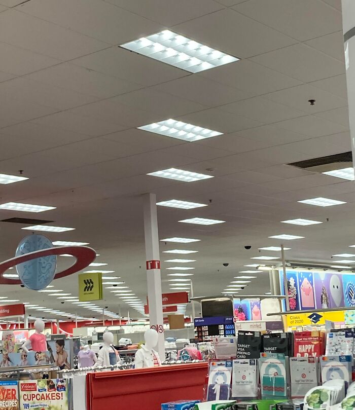 Retail store aisle with neatly arranged shelves and displays, illustrating imperfect things that annoy people with OCD.