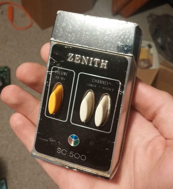 Vintage Zenith SC 500 remote control held in hand, showcasing classic 1950s technology and design from the era.