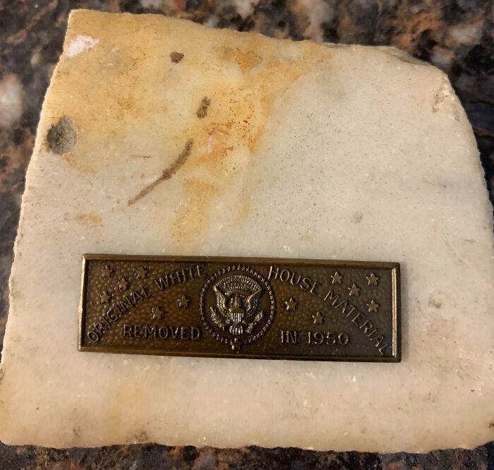 Plaque marking original White House material removed in 1950, capturing essence of life in the 1950s era.