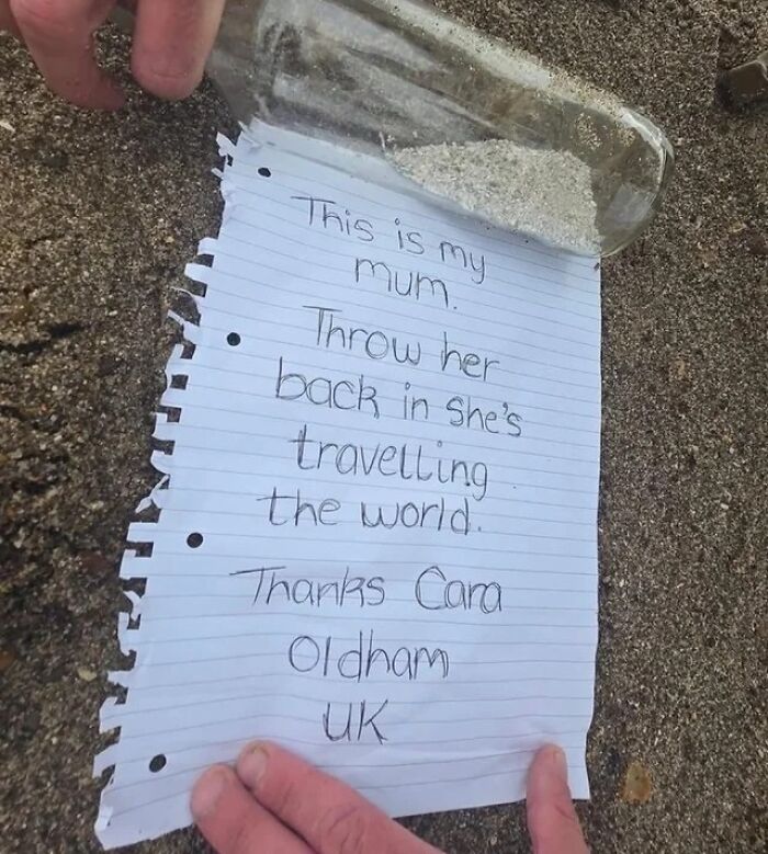 Handwritten note in a bottle on sand, part of interesting facts and pics shared by an online group.