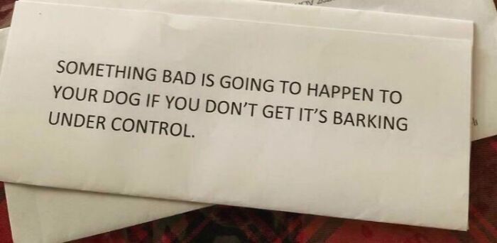 Note from an unhinged neighbor warning about consequences if dog barking is not kept under control in shared living space.