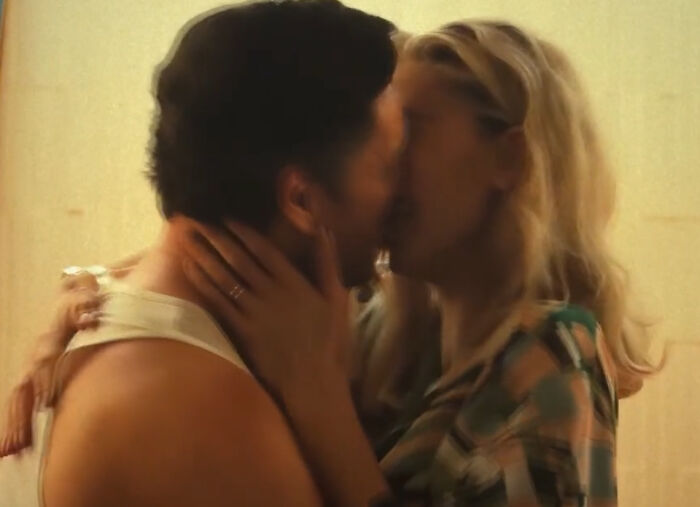 Couple sharing an intimate moment in a scene highlighting bad movie details from an online group dedicated to confusing movie moments.