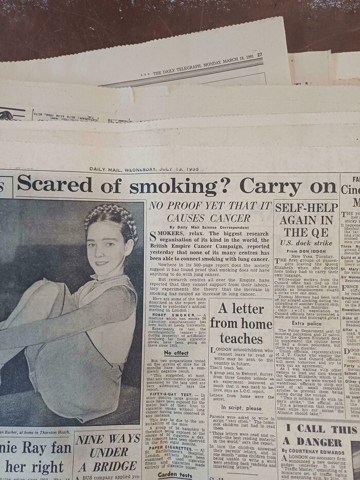 Black and white 1950s newspaper clipping discussing smoking and cancer, capturing the essence of life in the 1950s.