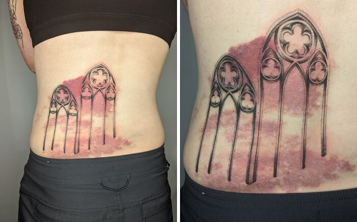 Tattoo art on lower back resembling stained glass windows with red birth marks blending into the design.