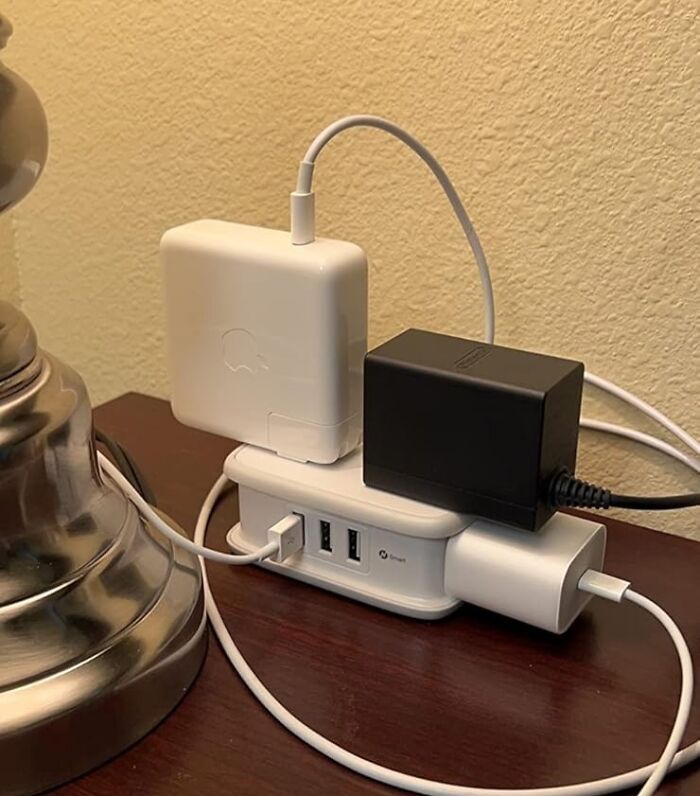 Compact travel charger with multiple outlets and USB ports reduces clutter and stress for hassle-free travel.