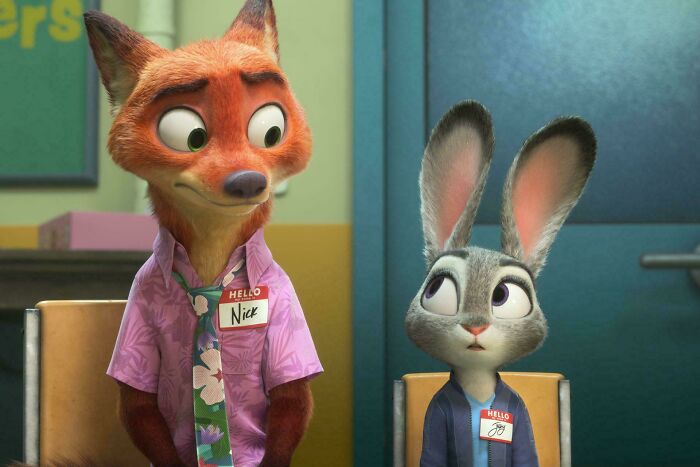 Animated fox and rabbit characters wearing name tags in a scene highlighting bad movie details from an online group.