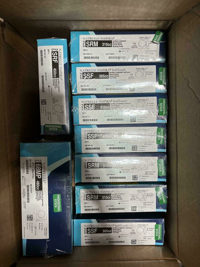 Boxes of Natrelle breast implants neatly packed, representing potential dumpster diving treasures raccoons would be wowed by.