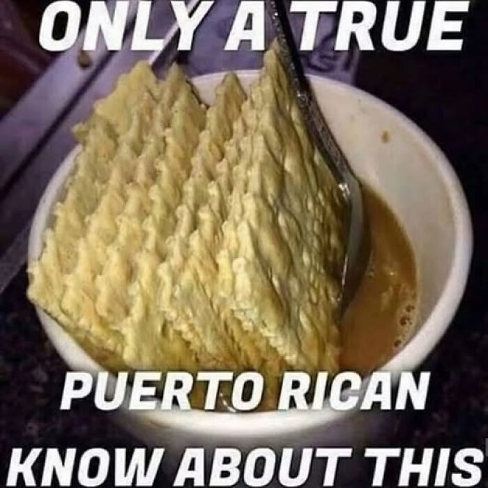 A cup of coffee with crackers being dipped, representing a funny meme about Hispanic culture and Puerto Rican tradition.