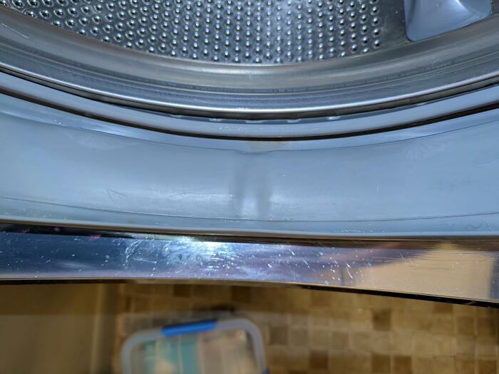 Close-up of a washing machine door seal, showing detail of a problem solver for appliance maintenance under $15.