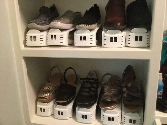 Shoe organizer products neatly arranging multiple pairs of shoes in a compact home storage shelf.