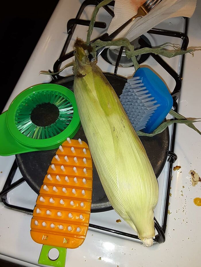 Various random items including corn on the cob and cleaning brushes, showcasing unexpectedly useful kitchen tools.
