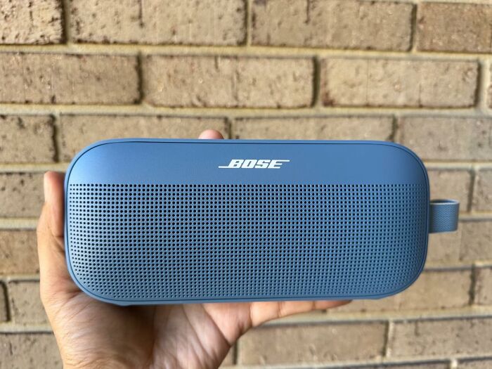 Hand holding a blue Bose speaker, one of the best sellers that topped the charts this past Prime Day.
