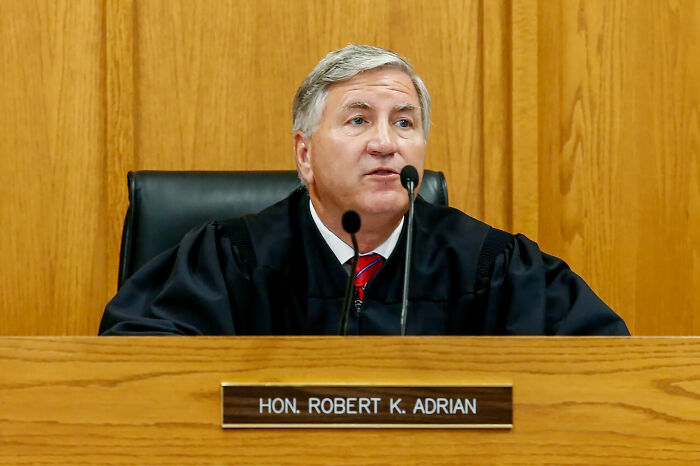 Judge Robert K. Adrian in courtroom delivering a verdict about people facing consequences of their own stupidity.