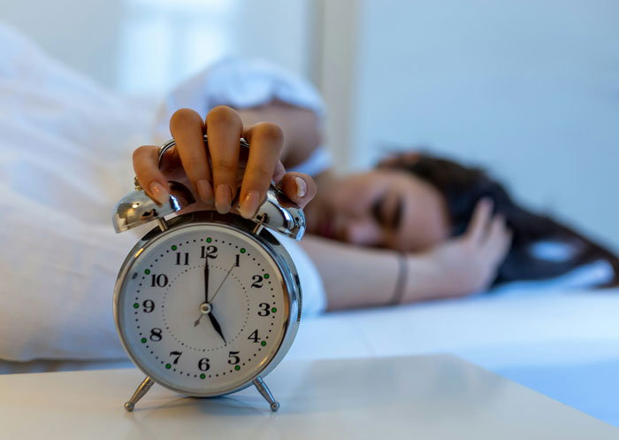 Tourist oversleeps in bed reaching to stop alarm clock, blaming guide for not waking her on multiple days. - 14