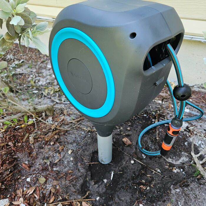 Compact outdoor garden hose reel with blue accents, one of the most wished for items on Amazon this week.
