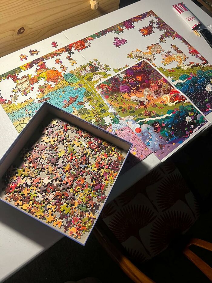 Partially completed colorful jigsaw puzzle on a table, illustrating a creative hobby to try after reaching the end of the internet.