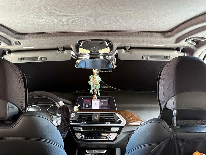 Car interior dashboard and seats featuring popular accessories from the most wished for items burning up Amazon this week