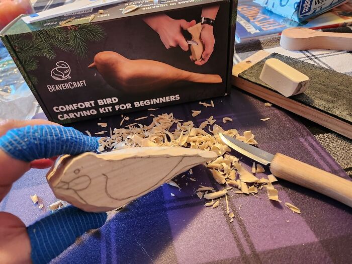Wood carving hobby in progress with comfort bird kit for beginners, trading screen time for skill time.