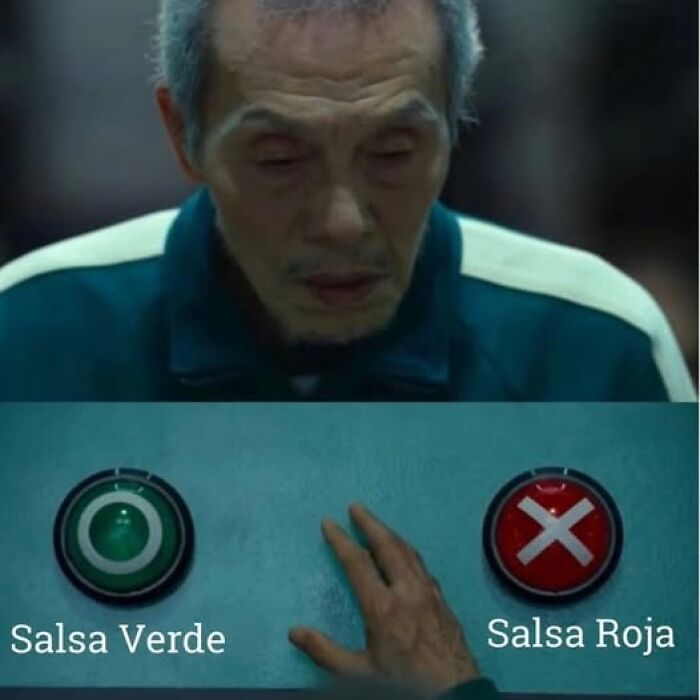 Man deciding between green and red salsa buttons, capturing a funny meme about being Hispanic and salsa preferences.