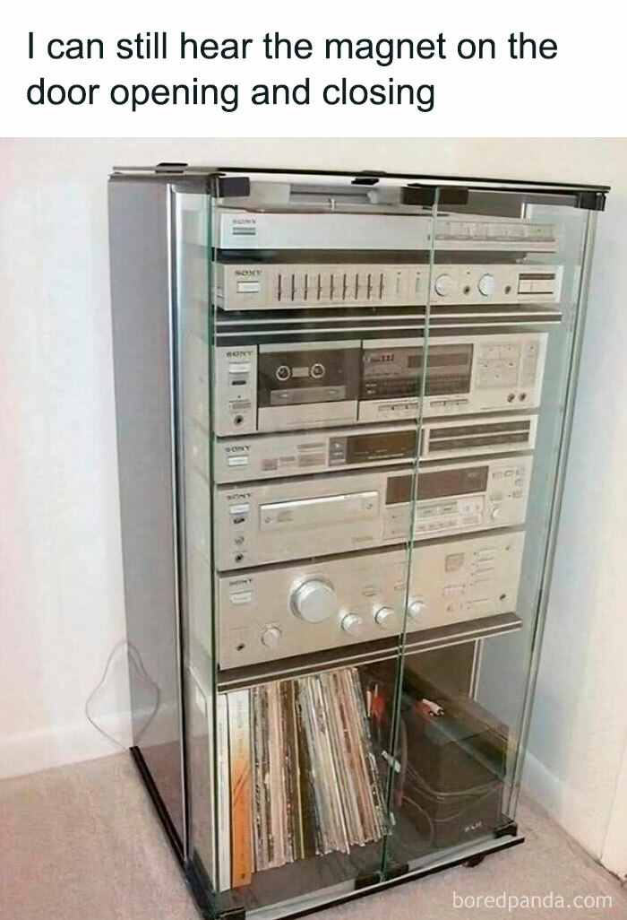 Vintage stereo system with glass doors and vinyl records, evoking nostalgic posts about growing up in the ’90s.