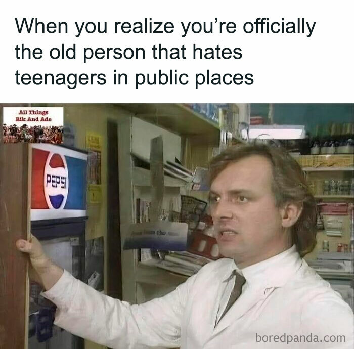 Man in a white coat looking annoyed near a vintage Pepsi machine, capturing 90s nostalgia and growing up memories.